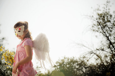 simsearch:614-08875870,k - Girl in angel wings and face mask Foto de stock - Sin royalties Premium, Código: 614-09210390