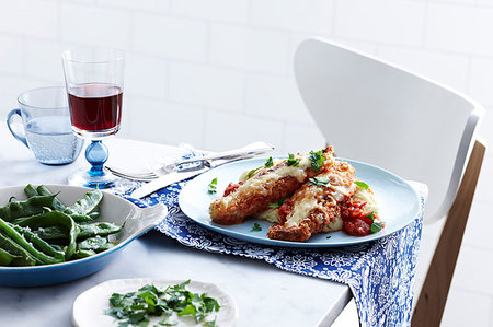 simsearch:649-07710547,k - Meal with dish of chicken parmigiana and green beans Stock Photo - Premium Royalty-Free, Code: 614-09210602