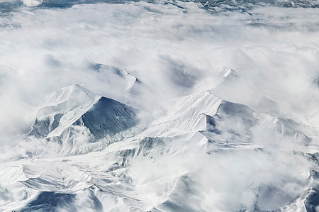 simsearch:6118-09039325,k - Aerial view of cloud and snow covered mountains, Western China, East Asia Photographie de stock - Premium Libres de Droits, Code: 614-09210986