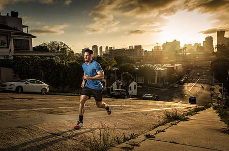 simsearch:614-07453273,k - Young male runner running up a steep city hill Stock Photo - Premium Royalty-Free, Code: 614-09211095