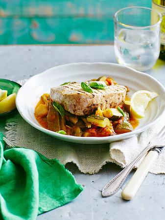 simsearch:614-07735621,k - Still life plate of tuna, bean and tomato stew with lemon garnish Stock Photo - Premium Royalty-Free, Code: 614-09211257