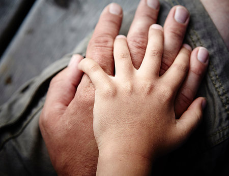 Close up of father and sons hands touching Stock Photo - Premium Royalty-Free, Code: 614-09211606