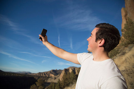 simsearch:614-08081221,k - Hiker taking selfie, Smith Rock State Park, Oregon, US Stock Photo - Premium Royalty-Free, Code: 614-09211740