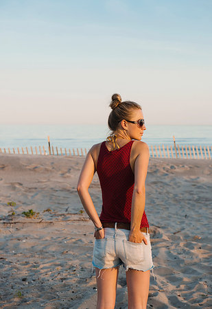 simsearch:649-08180388,k - Mid adult woman standing on Rockaway Beach, New York, USA Stock Photo - Premium Royalty-Free, Code: 614-09211794