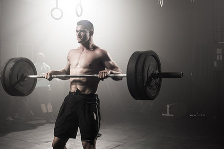 simsearch:614-08877527,k - Young man lifting barbell Stock Photo - Premium Royalty-Free, Code: 614-09211937