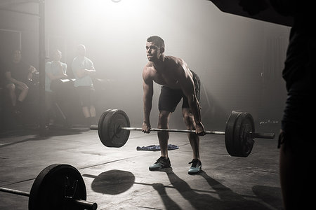 simsearch:614-08877527,k - Young man lifting barbell Stock Photo - Premium Royalty-Free, Code: 614-09211938