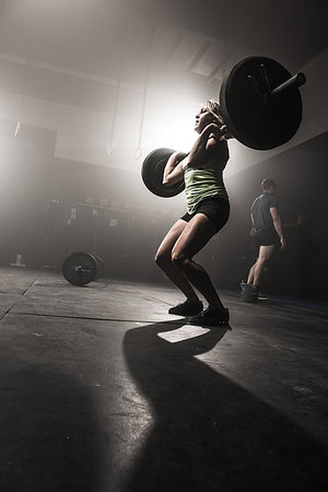 simsearch:614-08877527,k - Mid adult woman lifting barbell Stock Photo - Premium Royalty-Free, Code: 614-09211944
