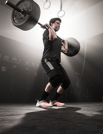 simsearch:614-08877527,k - Young man lifting barbell Stock Photo - Premium Royalty-Free, Code: 614-09211942