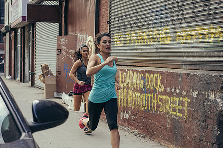 simsearch:614-08684939,k - Two young female runners running in city street Stock Photo - Premium Royalty-Free, Code: 614-09212115