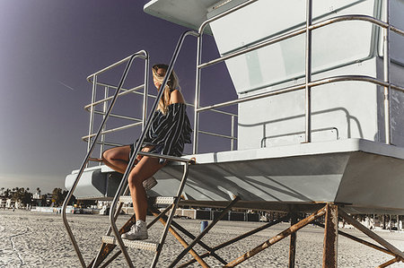 simsearch:614-09213744,k - Woman relaxing on lifeguard tower Stock Photo - Premium Royalty-Free, Code: 614-09213753