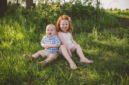 sibling sad - Young children crying on grass Stock Photo - Premium Royalty-Free, Code: 614-09213764