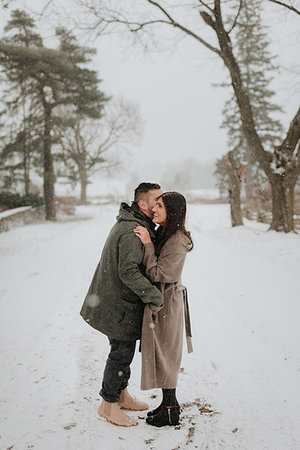 rural towns in canada - Couple hugging in snowy landscape, Georgetown, Canada Stock Photo - Premium Royalty-Free, Code: 614-09232009