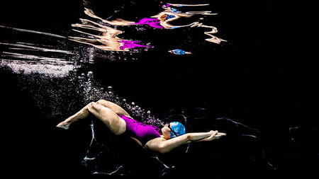 swimming caps for black women - Dolphin kick streamline Stock Photo - Premium Royalty-Free, Code: 614-09232199