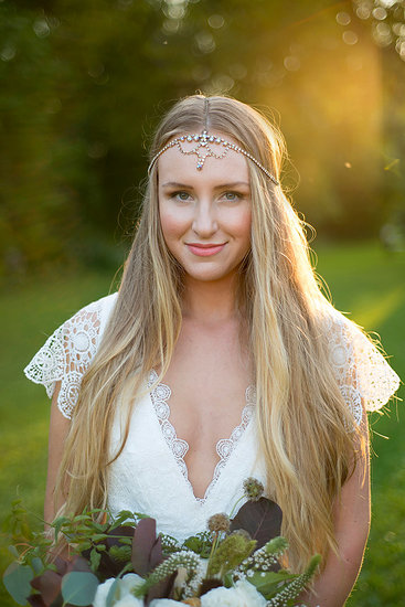 Bride with bouquet at sunset Stock Photo - Premium Royalty-Free, Image code: 614-09232218