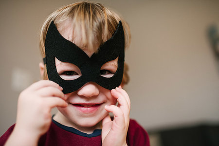 smile as mask for boy - Boy in costume mask Stock Photo - Premium Royalty-Free, Code: 614-09245110