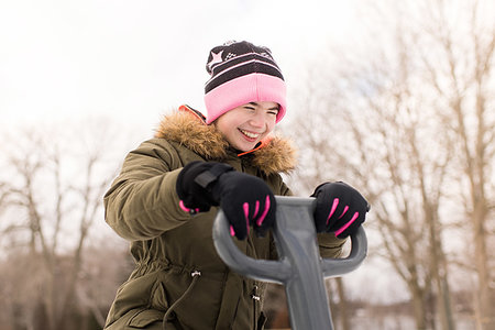 simsearch:614-09258754,k - Girl in knit hat laughing on playground equipment Photographie de stock - Premium Libres de Droits, Code: 614-09245241