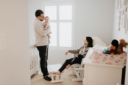 simsearch:614-03684139,k - Couple with baby daughter in baby's room Photographie de stock - Premium Libres de Droits, Code: 614-09249546