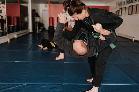 Couple practising martial arts in studio Stock Photo - Premium Royalty-Free, Code: 614-09249593