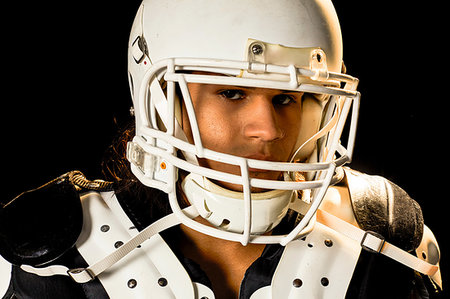 simsearch:614-00893424,k - Portrait of football player, black background Stock Photo - Premium Royalty-Free, Code: 614-09249754