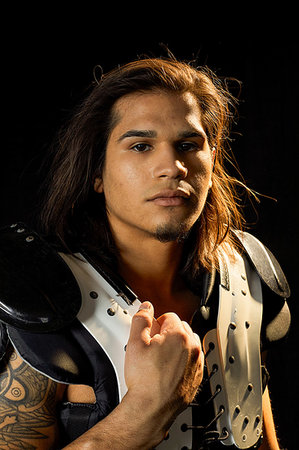 Portrait of football player, black background Foto de stock - Sin royalties Premium, Código: 614-09249751