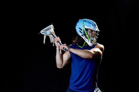 simsearch:614-00893424,k - Portrait of lacrosse player, black background Stock Photo - Premium Royalty-Free, Code: 614-09249767