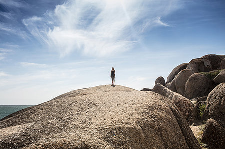 simsearch:614-09258792,k - Young woman practicing yoga taking a break standing on top of beach boulder, Cape Town, Western Cape, South Africa Stock Photo - Premium Royalty-Free, Code: 614-09258791
