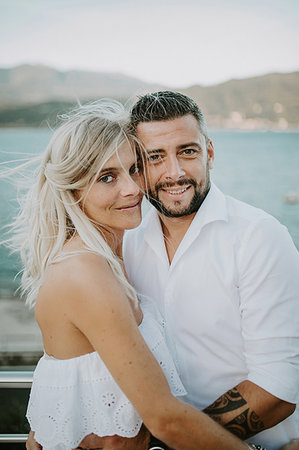 stresa - Romantic mid adult couple hugging on lakeside, portrait, Stresa, Piemonte, Italy Stock Photo - Premium Royalty-Free, Code: 614-09258909