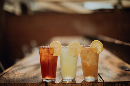 soda still life - Three glasses of iced fruit drinks on cafe table, shallow focus Stock Photo - Premium Royalty-Free, Code: 614-09259078