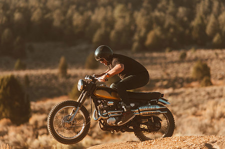 simsearch:614-09259136,k - Motorbiker riding through landscape of Kennedy Meadows, California, US Fotografie stock - Premium Royalty-Free, Codice: 614-09259140