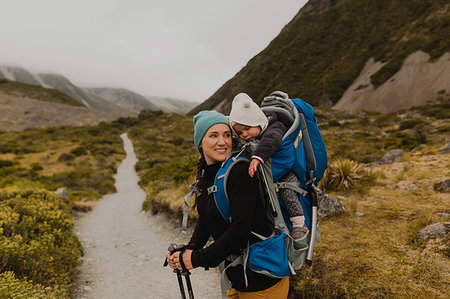 Hiker and baby exploring trail, Wanaka, Taranaki, New Zealand Stock Photo - Premium Royalty-Free, Code: 614-09259227