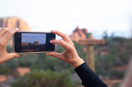 Woman taking photograph of landscapes, Sedona, Arizona, USA Stock Photo - Premium Royalty-Free, Code: 614-09253771