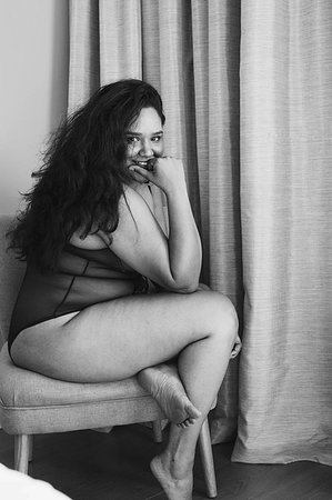 fat women seducing adults - Woman in lingerie posing on chair in room Stock Photo - Premium Royalty-Free, Code: 614-09276553