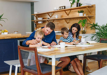 simsearch:614-09276703,k - Parents helping children with homework at home Stock Photo - Premium Royalty-Free, Code: 614-09276605