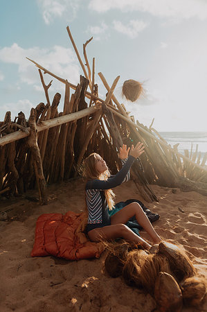 survival tent - Woman by tent happy with her collection of coconuts, Princeville, Hawaii, US Stock Photo - Premium Royalty-Free, Code: 614-09270245