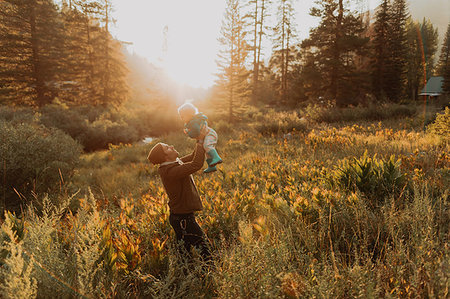 simsearch:614-09270476,k - Mid adult man holding up toddler daughter in rural valley at sunset, Mineral King, California, USA Stock Photo - Premium Royalty-Free, Code: 614-09270427