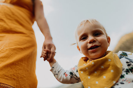 simsearch:614-09270476,k - Pregnant mother holding toddler daughter's hand, low angle cropped portrait, Mineral King, California, USA Stock Photo - Premium Royalty-Free, Code: 614-09270448