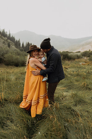 simsearch:614-06898419,k - Pregnant mid adult couple hugging toddler daughter in rural valley, portrait, Mineral King, California, USA Stock Photo - Premium Royalty-Free, Code: 614-09270466