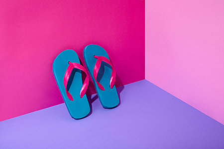 pink flip flops beach - Pair of colourful flip-flops leaning on wall Stock Photo - Premium Royalty-Free, Code: 614-09270549