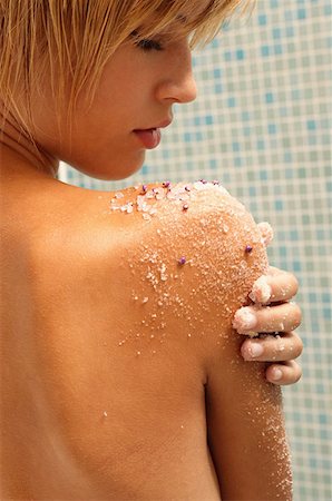 Young woman exfoliating arm Stock Photo - Premium Royalty-Free, Code: 614-00378677