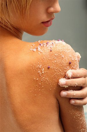 Young woman exfoliating arm Stock Photo - Premium Royalty-Free, Code: 614-00378678