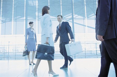 Businesspeople in airport terminal Stock Photo - Premium Royalty-Free, Code: 614-00395688