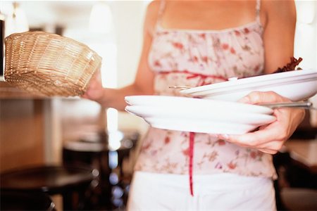 Waitress clearing table Stock Photo - Premium Royalty-Free, Code: 614-00390100