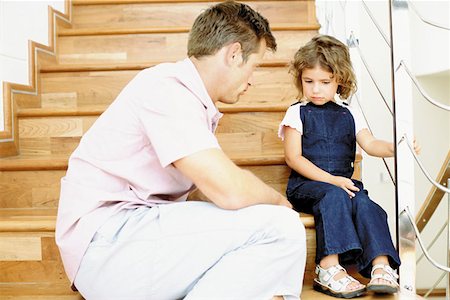 parent scolding kids - Father telling off naughty daughter Stock Photo - Premium Royalty-Free, Code: 614-00390620