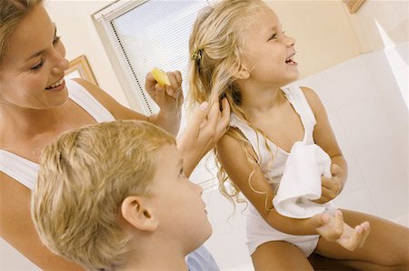 Family in bathroom Stock Photo - Premium Royalty-Free, Code: 614-00391627