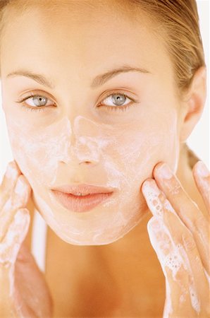 face and cleanse and one person - Woman washing face Stock Photo - Premium Royalty-Free, Code: 614-00393937