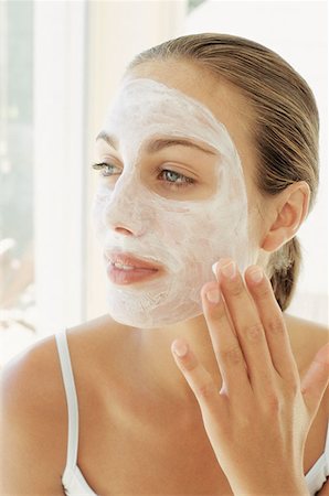 face and cleanse and one person - Woman applying face mask Stock Photo - Premium Royalty-Free, Code: 614-00393946