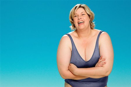 fat person in bathing suit - Big and happy Stock Photo - Premium Royalty-Free, Code: 614-00401076