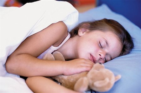 Girl sleeping with teddy bear Stock Photo - Premium Royalty-Free, Code: 614-00594187