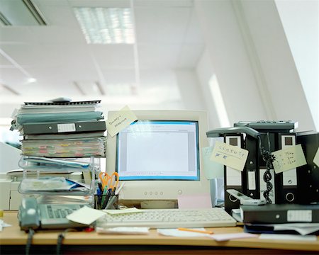 Messy office desk Stock Photo - Premium Royalty-Free, Code: 614-00594245