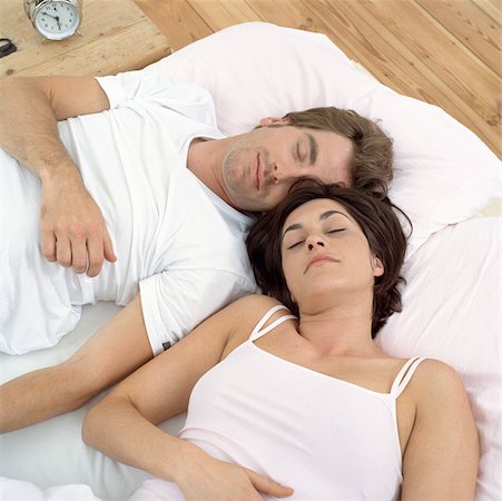 simsearch:614-00599224,k - Close couple asleep in bed Stock Photo - Premium Royalty-Free, Code: 614-00594450